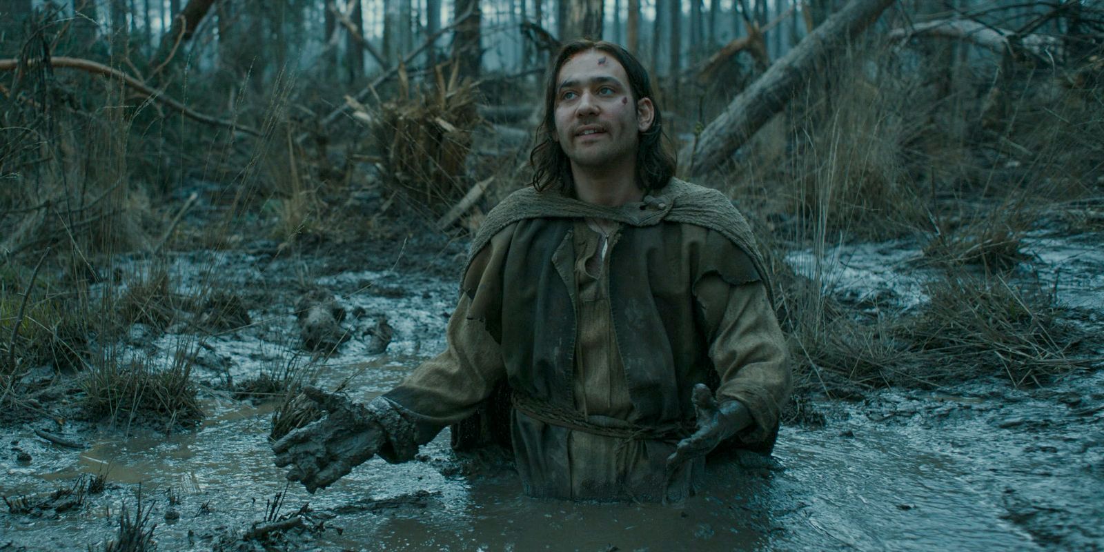 Isildur (Maxim Baldry) trapped in quicksand in The Lord of the Rings: The Rings of Power Season 2 Episode 4