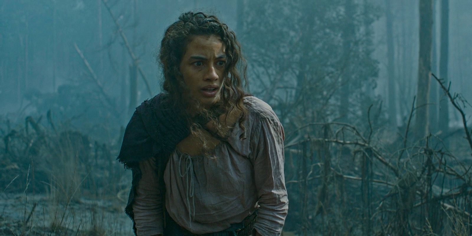 Estrid (Nia Towle) shocked after Isildur and Arondir were sucked into a swamp in The Lord of the Rings: The Rings of Power Season 2 Episode 4