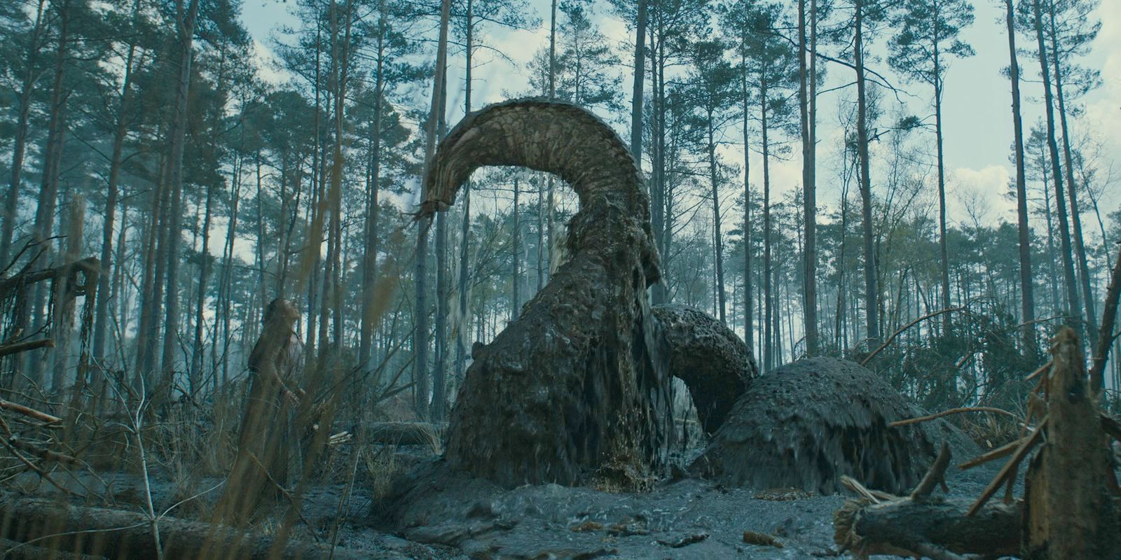 A monster emerges from the swamp and attempts to attack Estrid in The Lord of the Rings: The Rings of Power Season 2 Episode 4