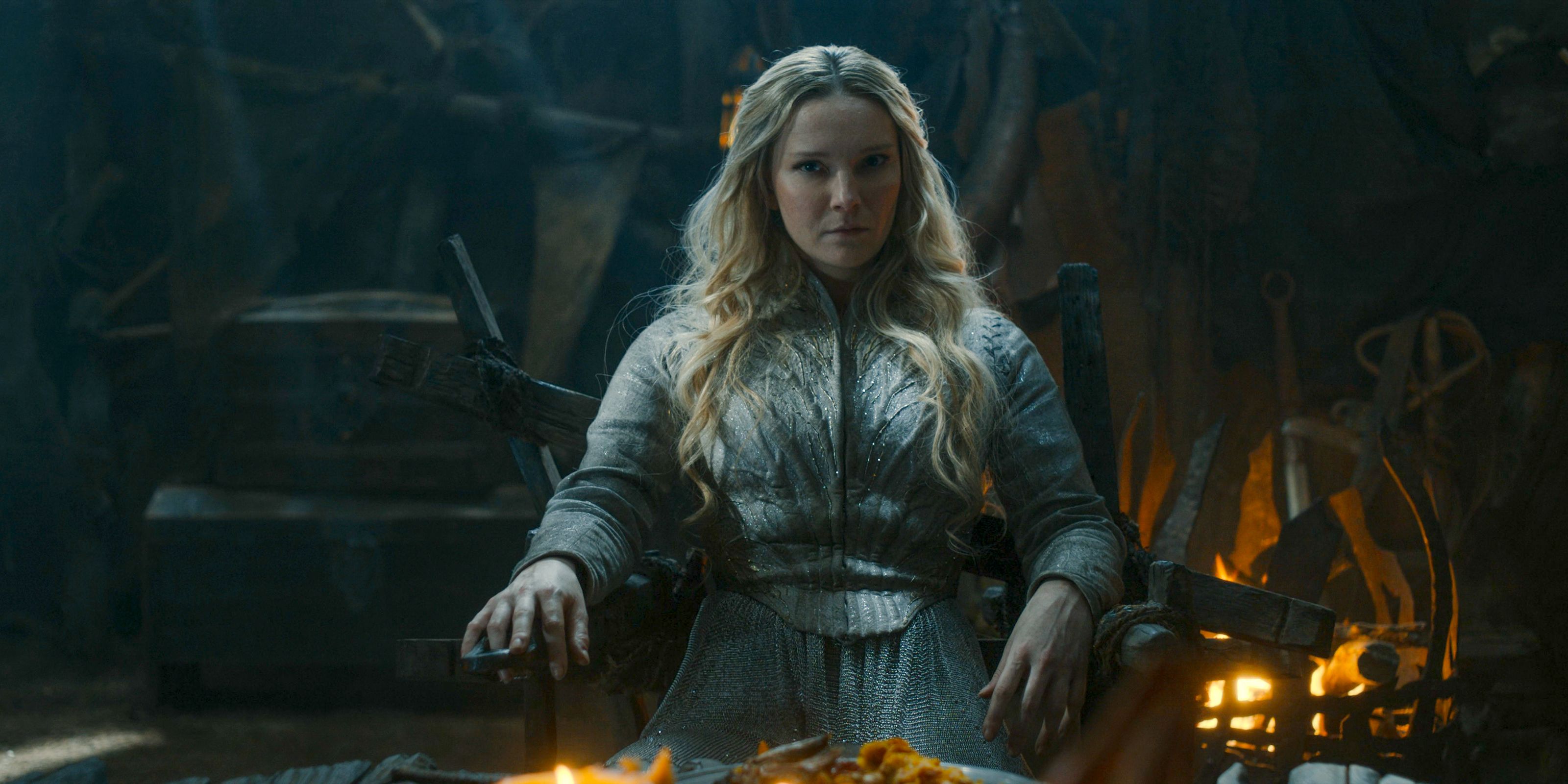 Galadriel (Morfydd Clark) dining with Adar as his prisoner in The Lord of the Rings: The Rings of Power Season 2 Episode 6