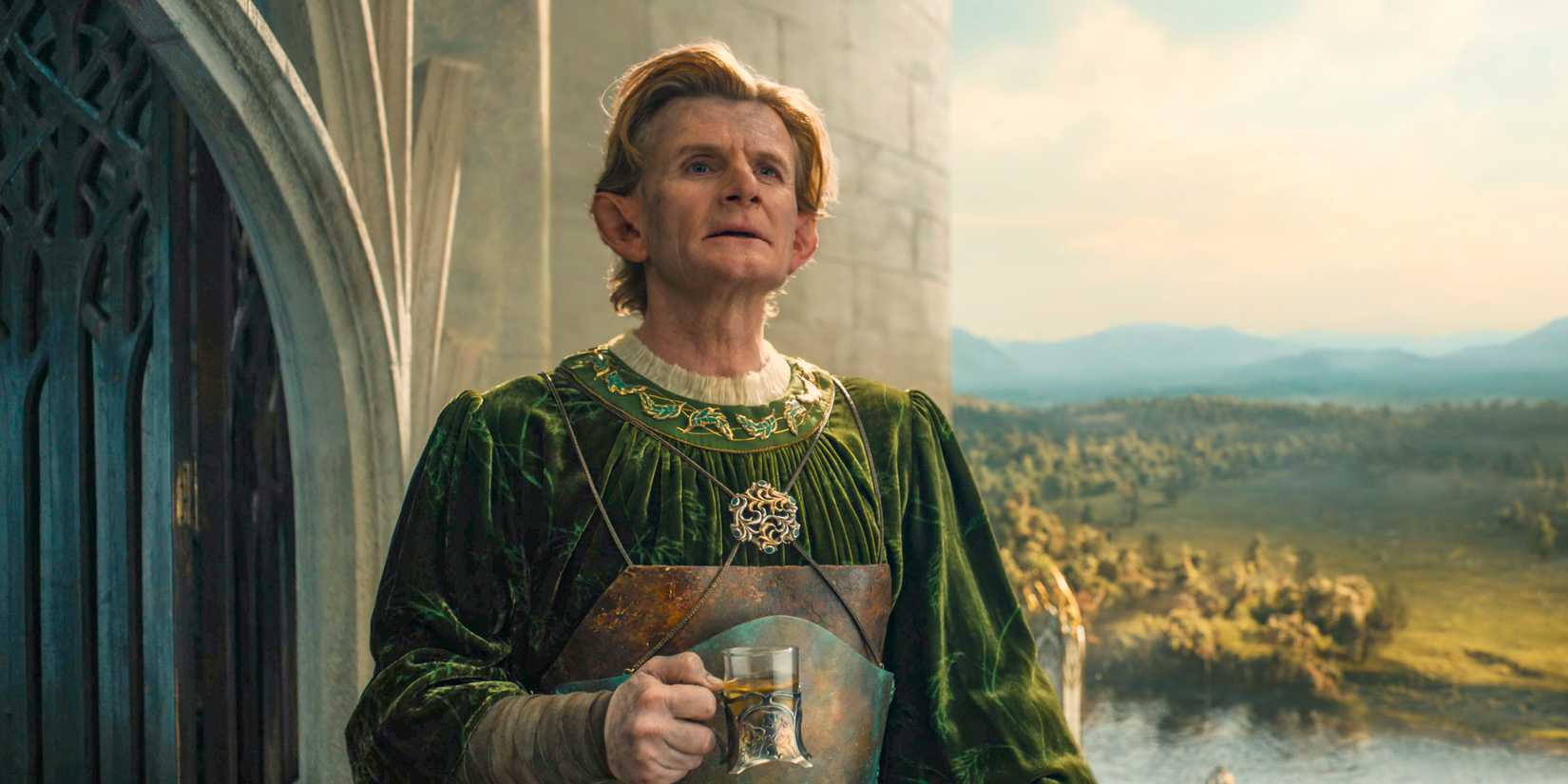 Celebrimbor (Charles Edwards) looking at a radiant Eregion in The Lord of the Rings: The Rings of Power Season 2 Episode 7