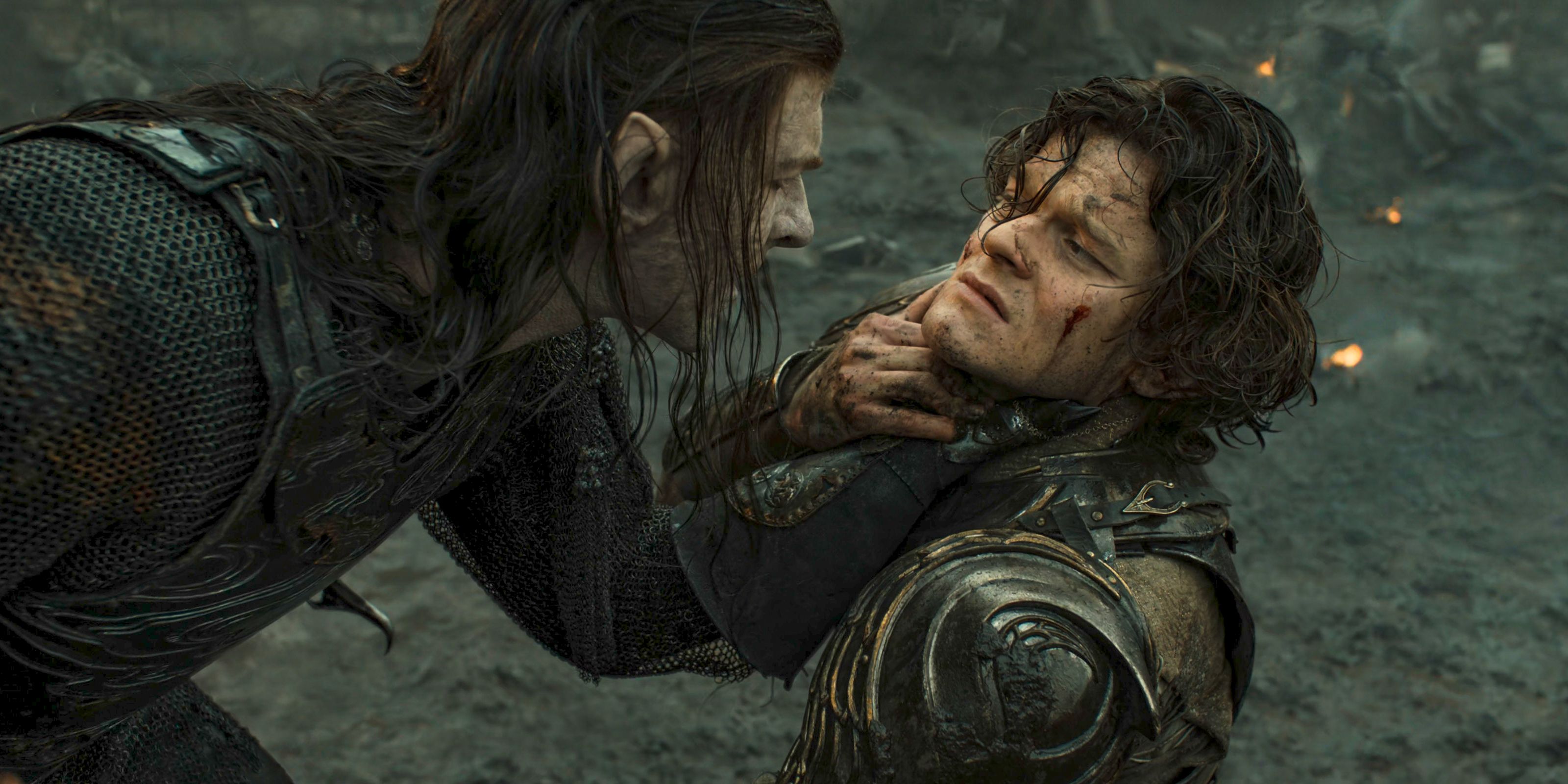 Adar (Sam Hazeldine) grabbing Elrond (Robert Aramayo) by the neck in The Lord of the Rings: The Rings of Power Season 2 Episode 7