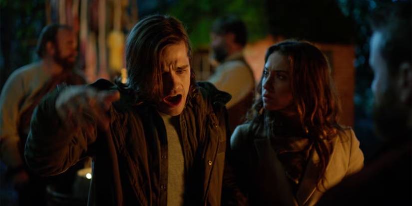 Julia looking at Quentin as he makes a pained expression in The Magicians