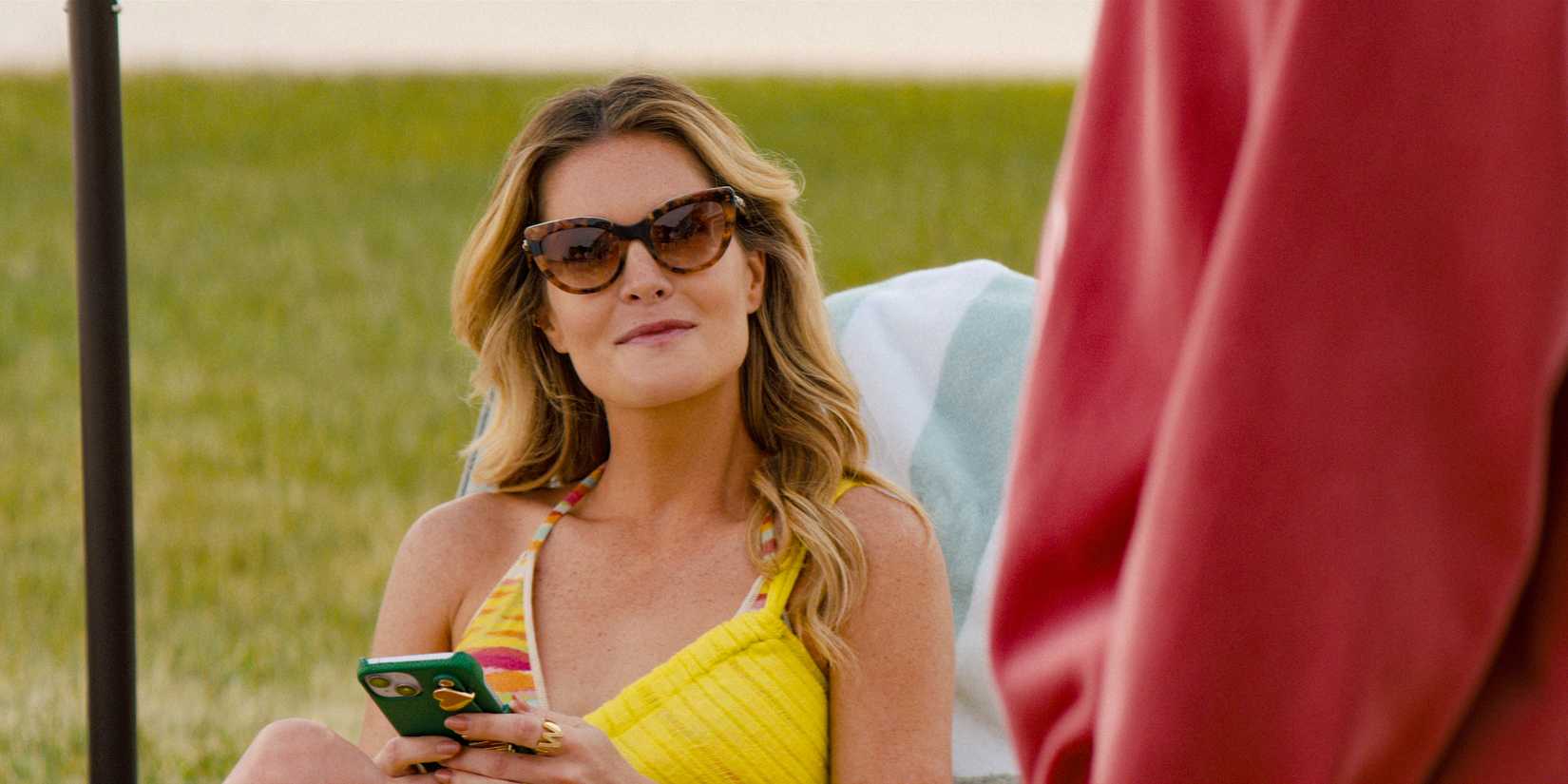 Merritt Monaco (Meghann Fahy) sunbathing in The Perfect Couple
