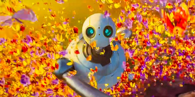 Roz frolicking in a field of leaves in The Wild Robot