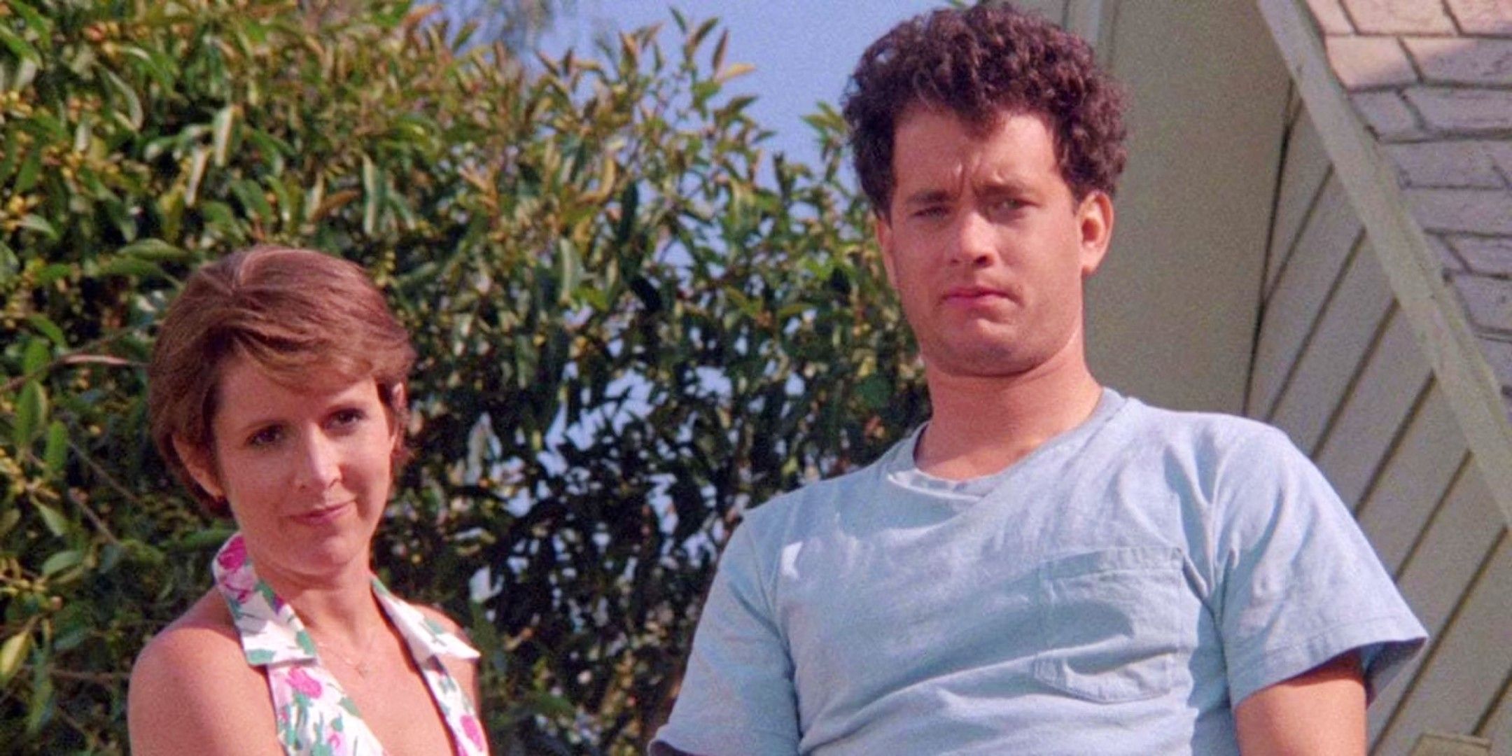 Tom Hanks and Carrie Fisher look out over street in The 'Burbs