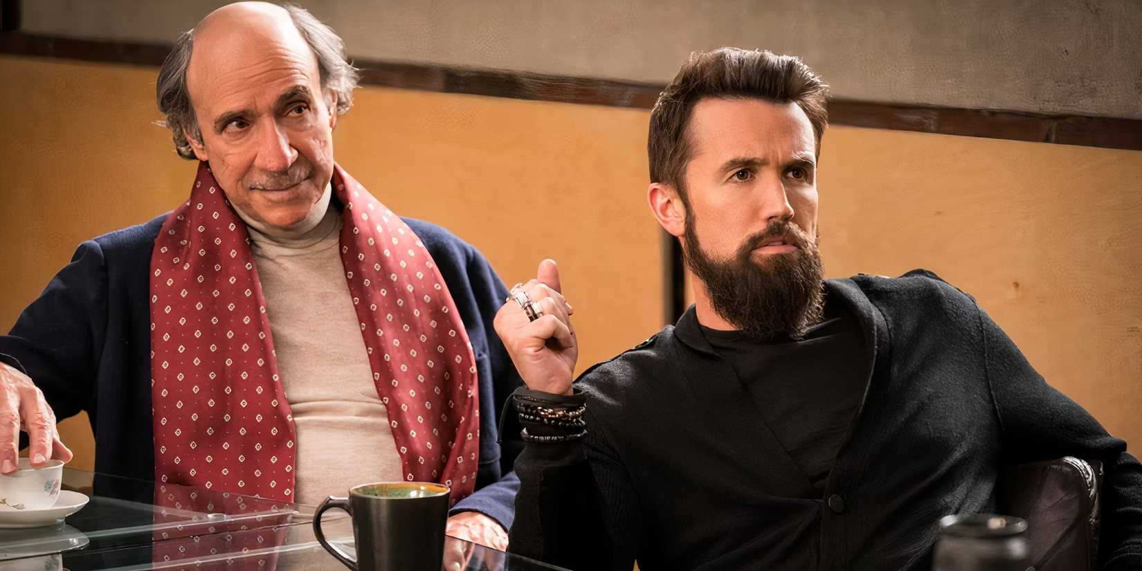 Rob McElhenney as Ian Grimm and F. Murray Abraham as Carl Longbottom in a meeting together in Mythic Quest.