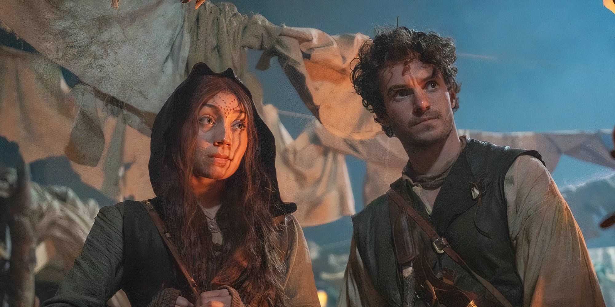 Alexander Hackett as Hunter and Oriana Charles as Ren looking exhausted in a market in Ren.