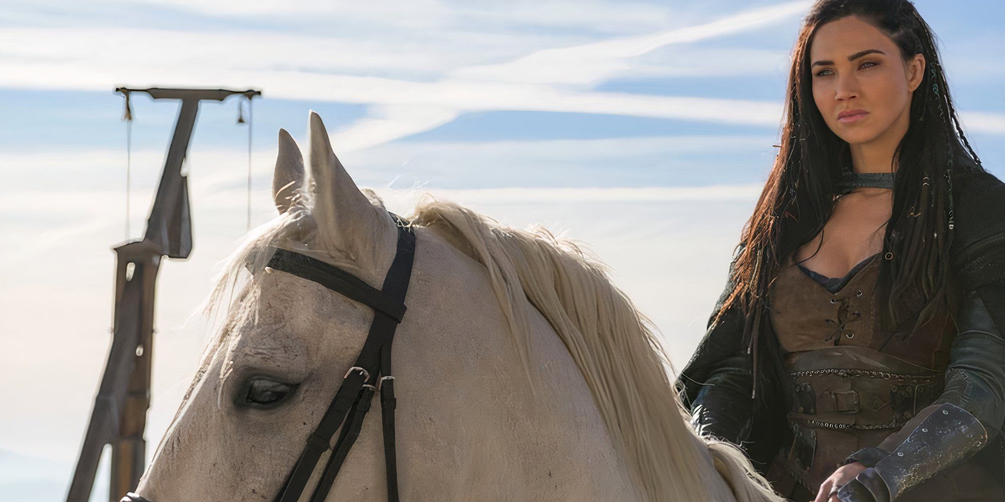 Jessica Green as Talon riding a white horse in The Outpost.