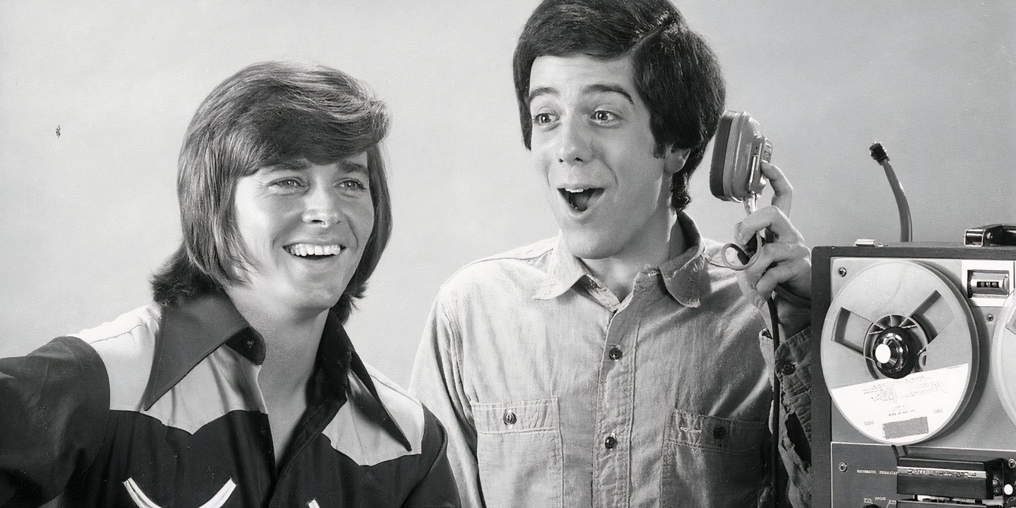 Bobby Sherman as Bobby Conway and Wes Stern as Lionel Poindexter smiling and recording a song together in Getting Together.