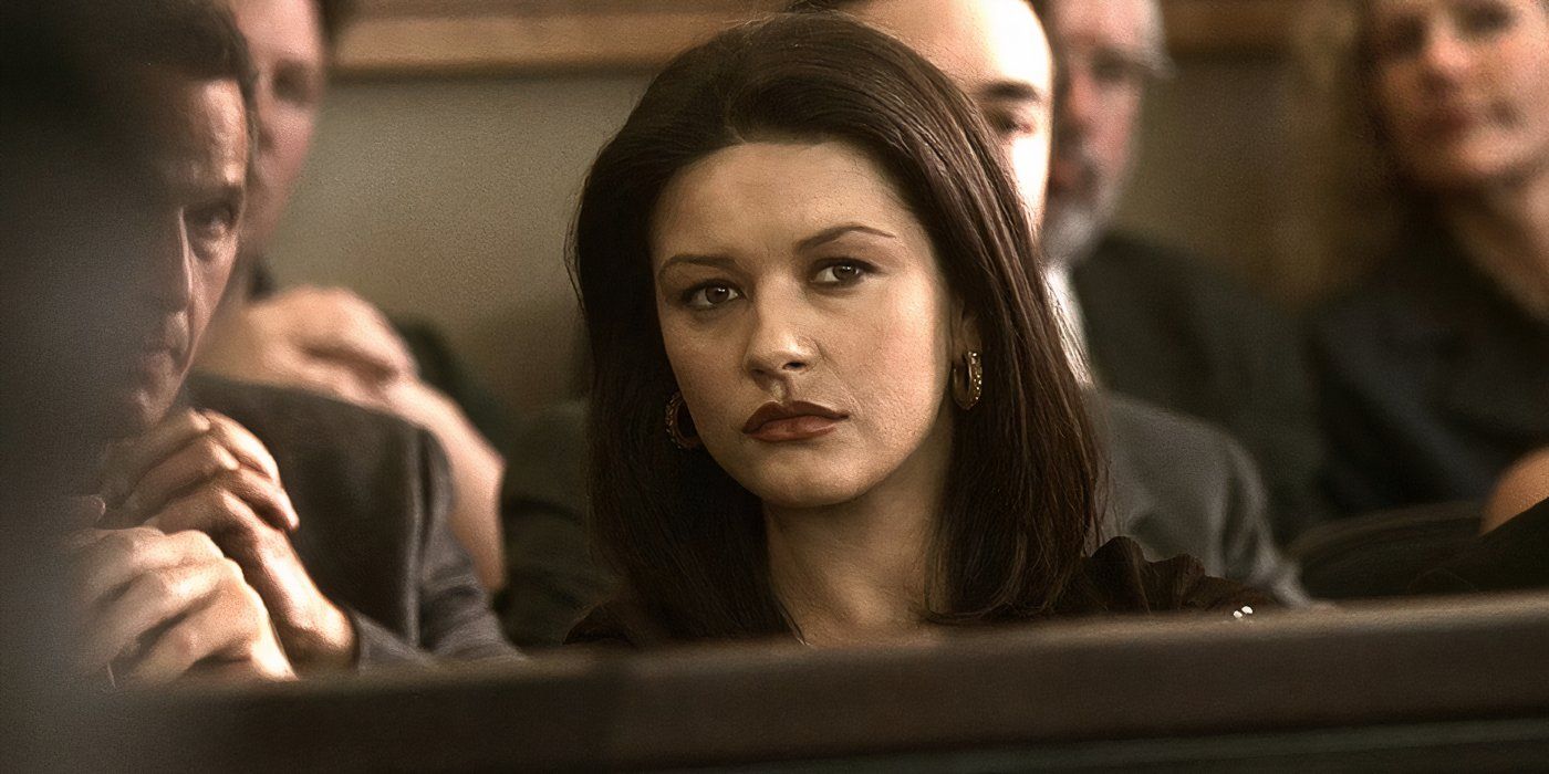 Catherine Zeta-Jones as Helena Ayala listening intently in a courtroom in Traffic.