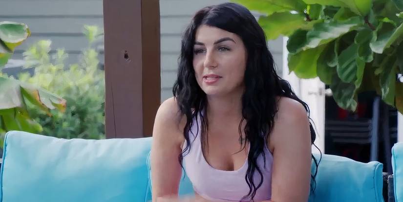 Veah Netherton in 90 Day Fiance in purple top sitting outside talking