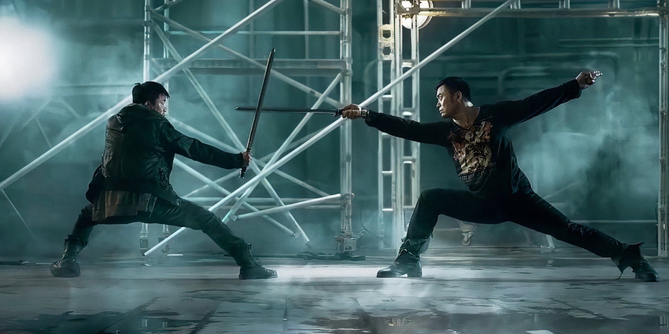 Wang Baoqiang and Siu-Wong Fan fight one another with swords.