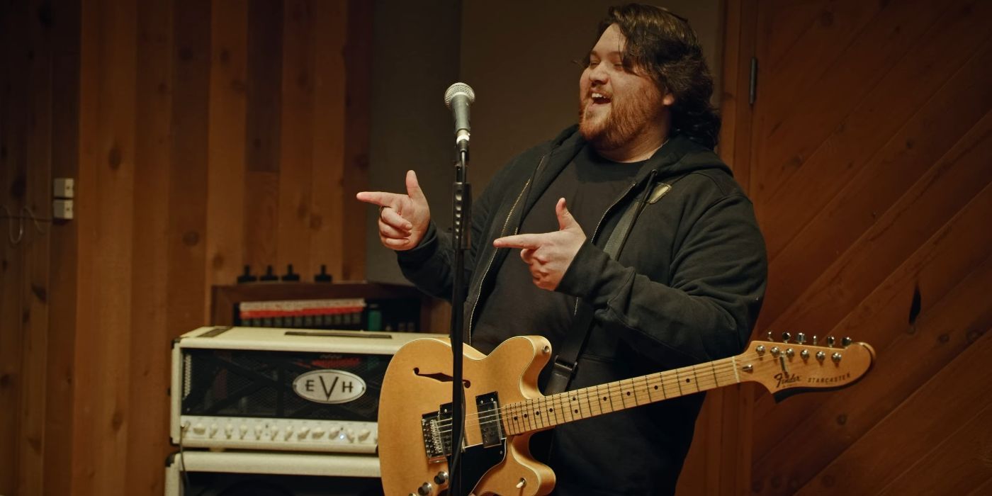 Wolfgang Van Halen shooting finger guns and laughing in a Mammoth WVH music video.