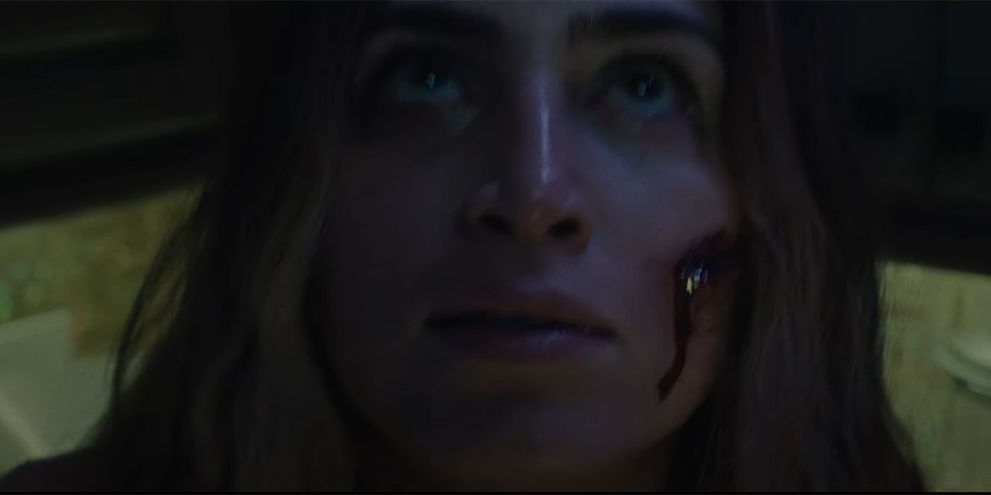 Woman with blood on her face in Blood Lake