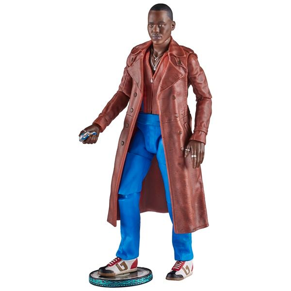 Fifteenth Doctor holding his sonic screwdriver as an action figure while stepping on something