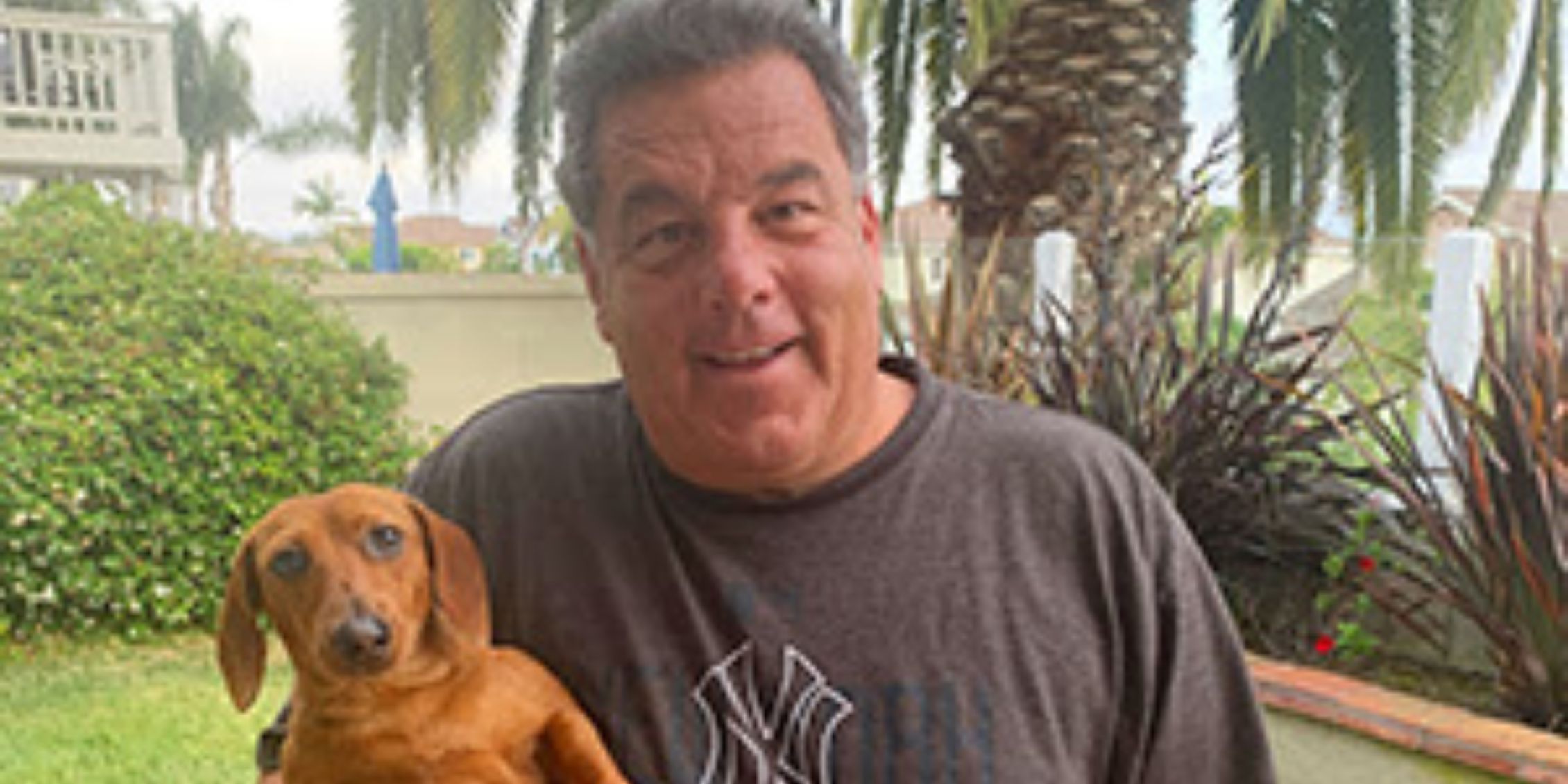 Blue Bloods real-life photo of Steve Schirripa in his yard holding Willie Boy