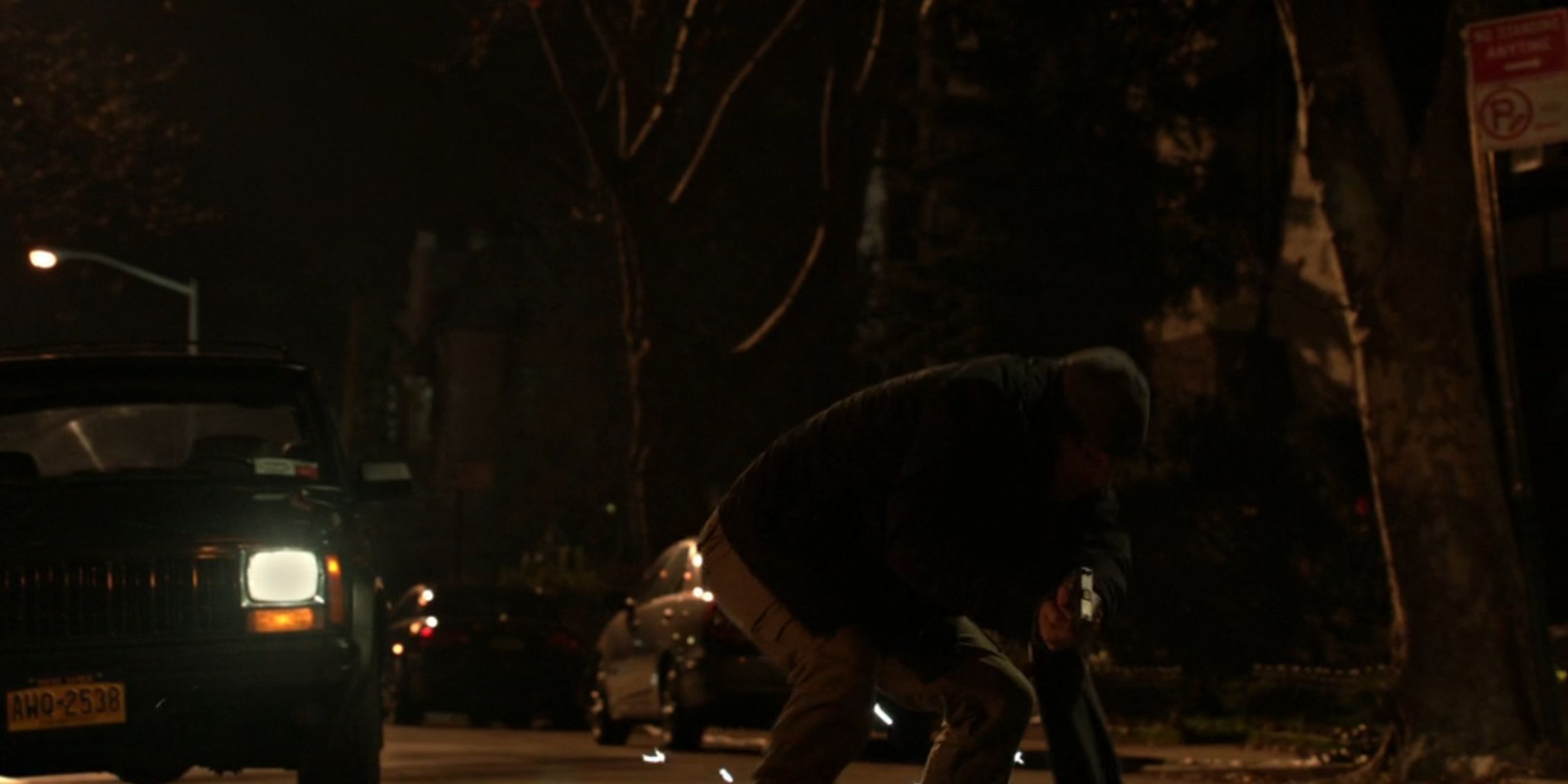 Blue Bloods Danny returns fire on a gunman on a dark street near where his family is in the car