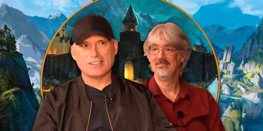 D&D designers Chris Perkins and James Wyatt in front of art from the 2024 Dungeon Master's Guide.