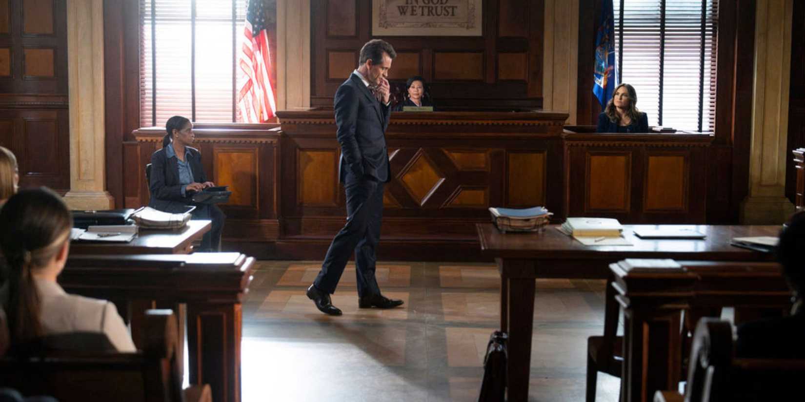 Law & Order long shot of Price in the courtroom pacing back and forth while Benson is on the stand