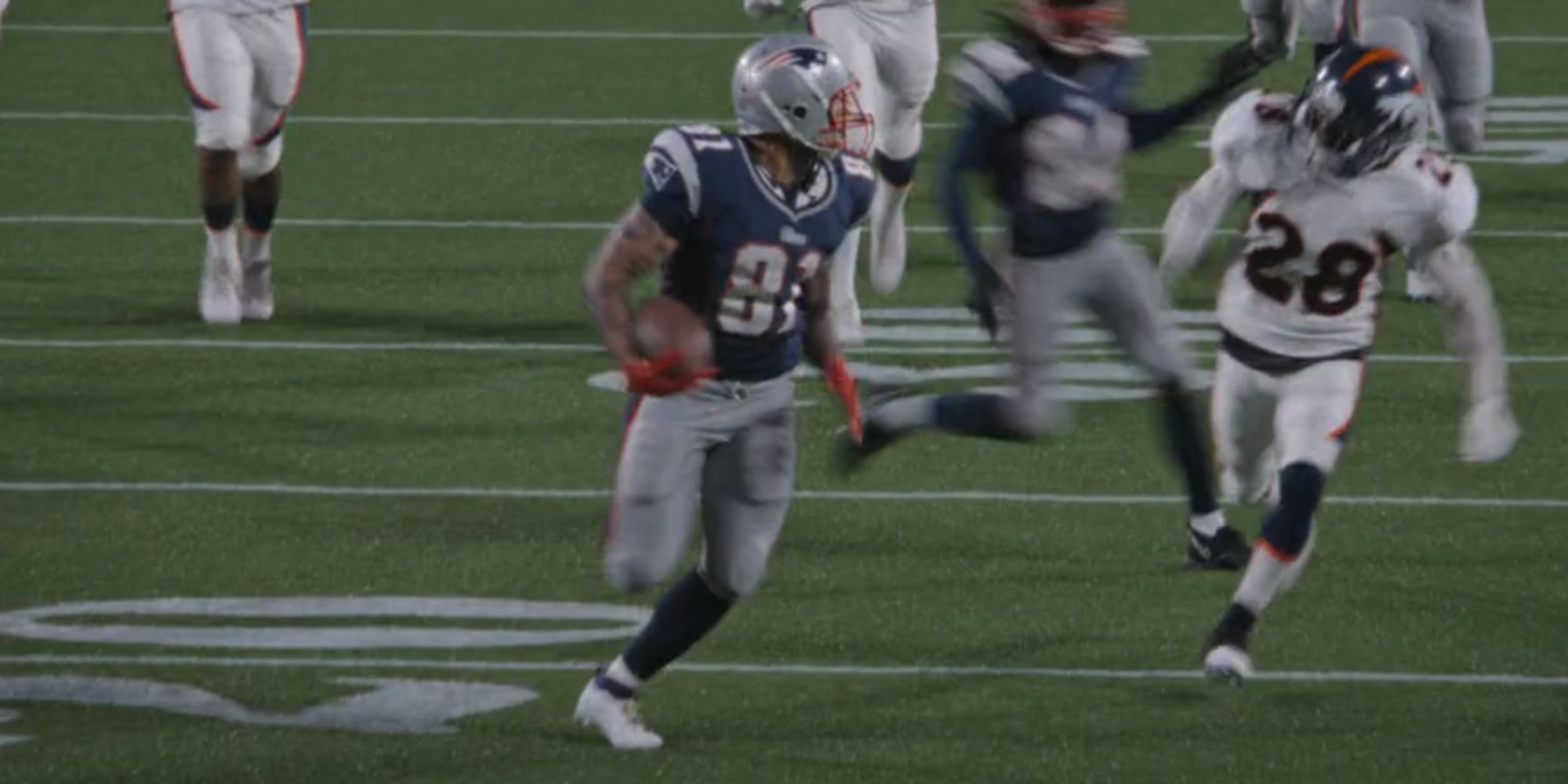 Josh Rivera runs with the football as Aaron Hernandez on American Sports Story