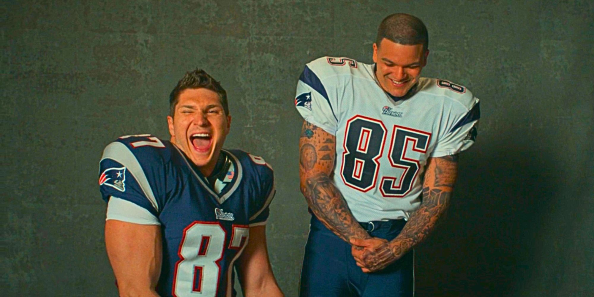 Laith Wallscheleger laughing as Rob Gronkowski as Josh Rivera smiles as Aaron Hernandez in American Sports Story