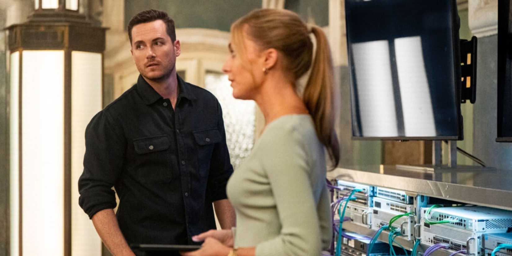 FBI: International Wes stands next to Tate who is fidgeting nervously