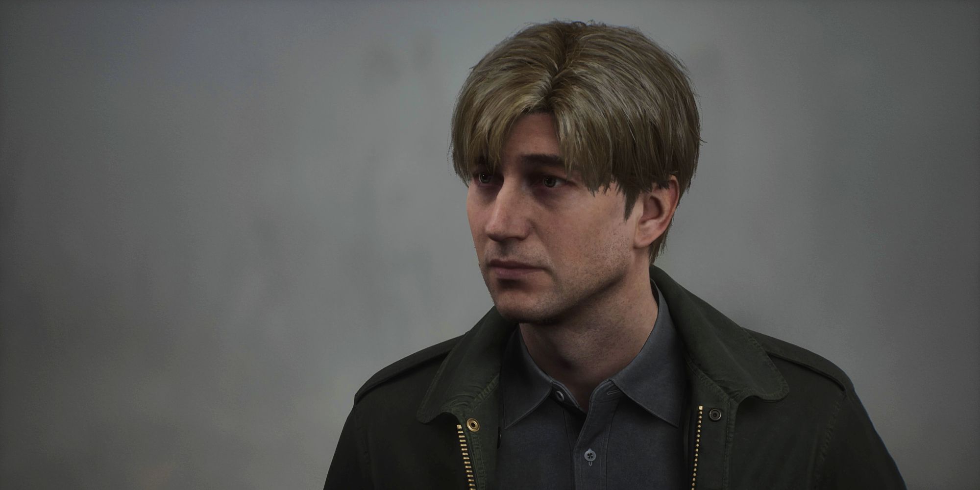 A dejected-looking James amid the fog in a screenshot from the Silent Hill 2 remake.