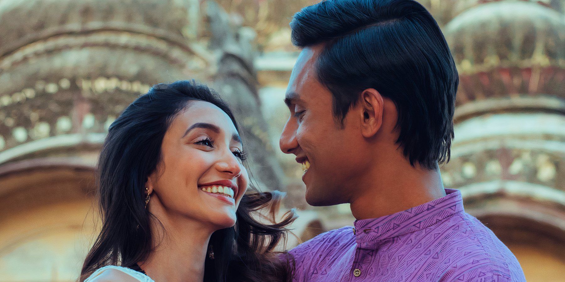 A man and woman smile at one another in the Hindi series Bandish Bandits