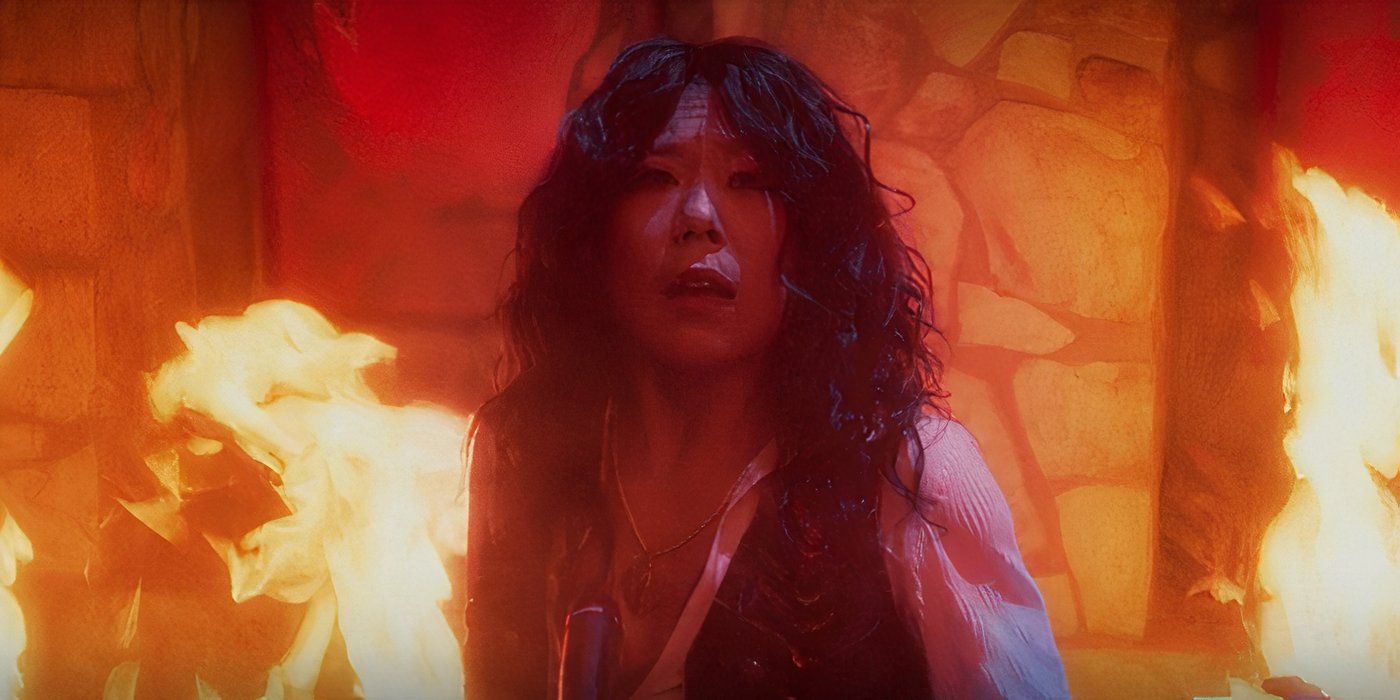 Alice Wu-Gulliver singing the Ballad of the Witches Road amid flames in Agatha All Along (2024)