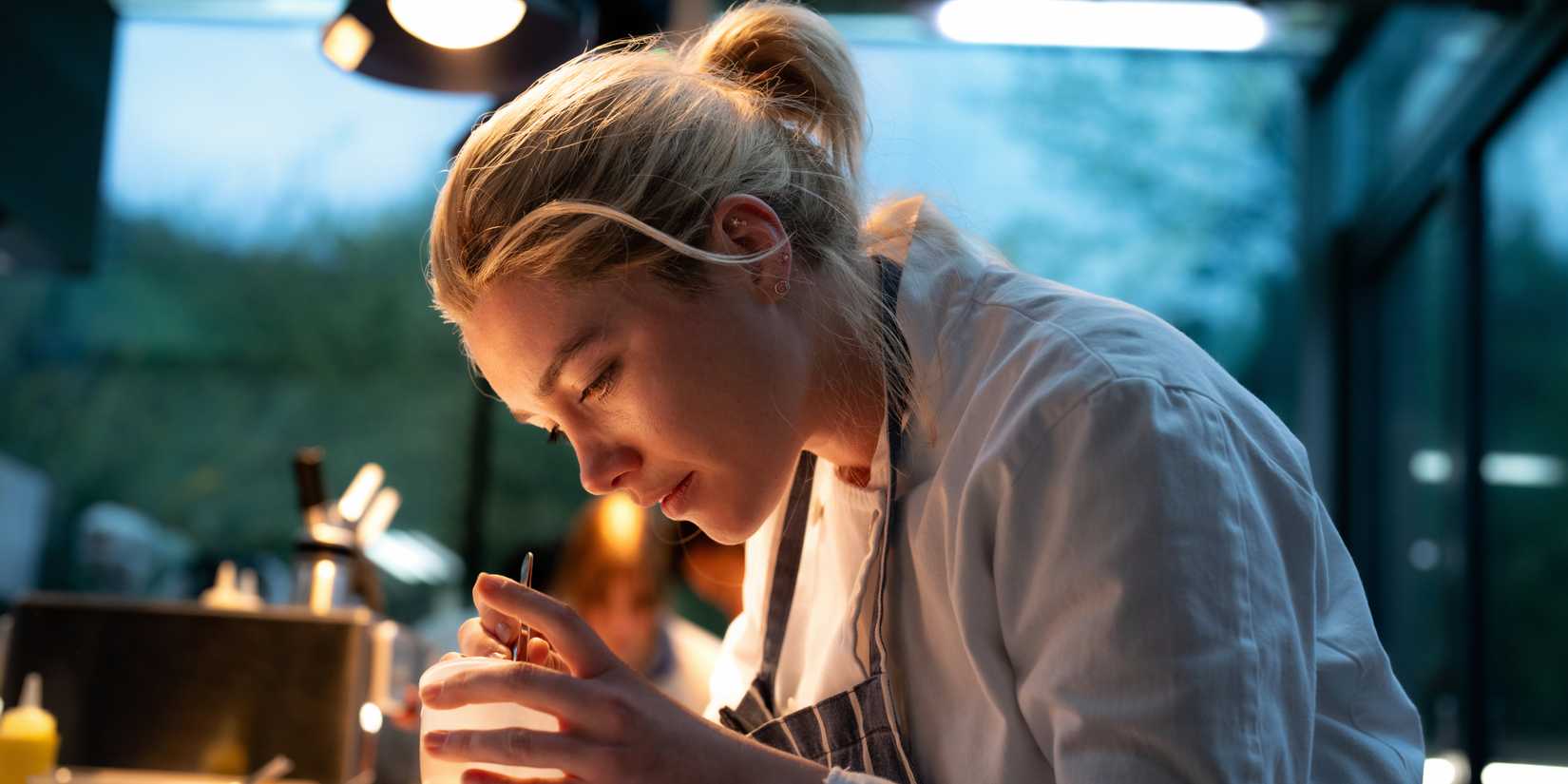 Almut puts finishing touches on a dish in We Live in Time