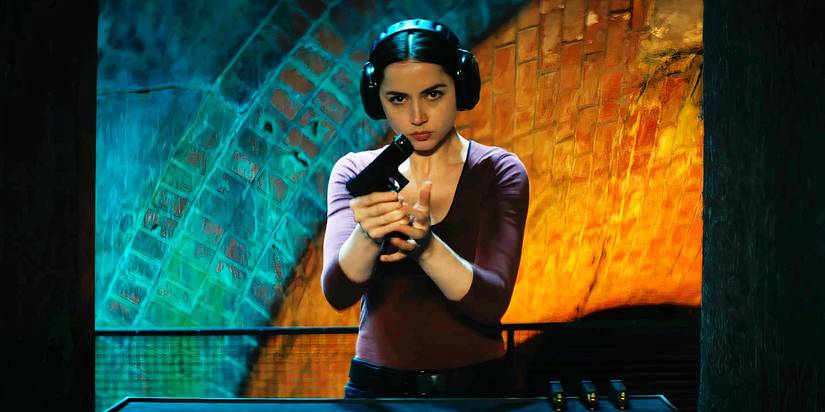 Ana de Armas reloading a pistol as Eve in Ballerina