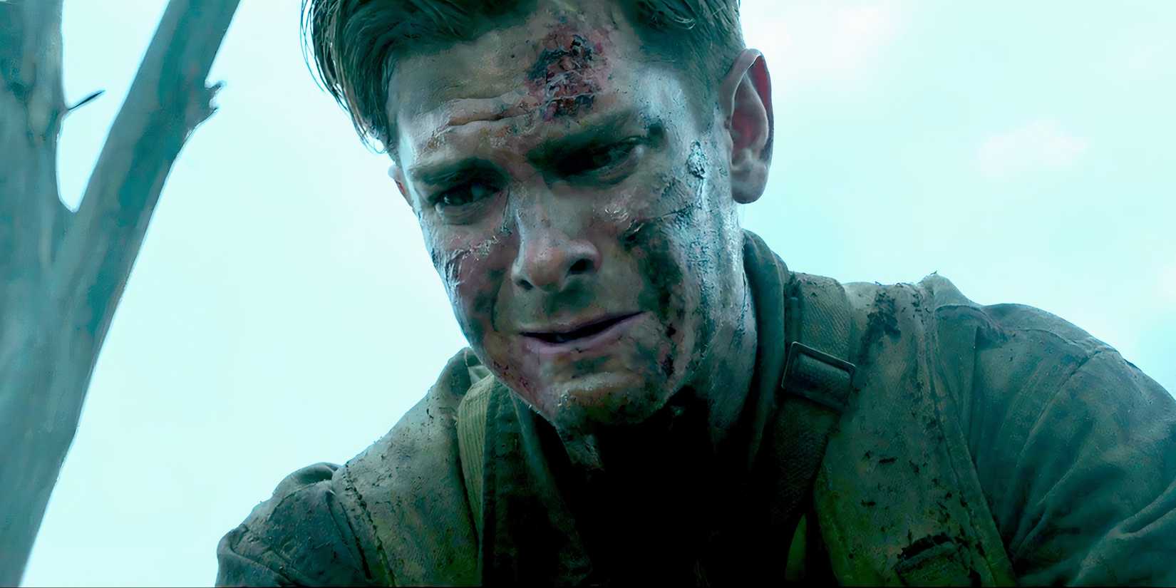 Andrew Garfield as Desmond crying over someone in the battlefield in Hacksaw Ridge