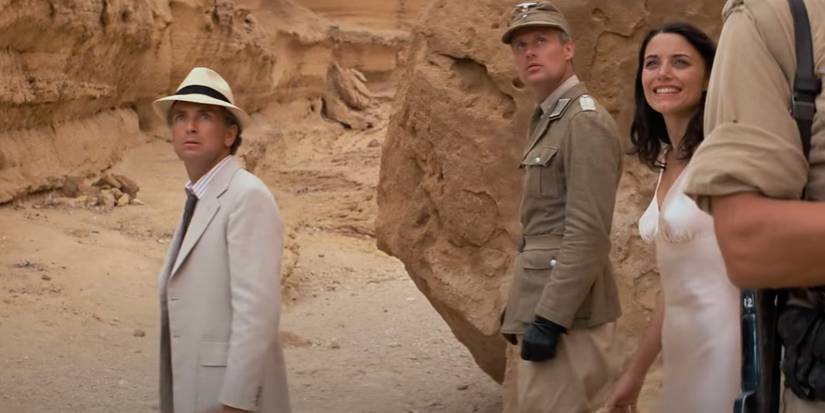 Paul Freeman and Karen Allen as Belloq and Marion in the desert in Raiders of the Lost Ark