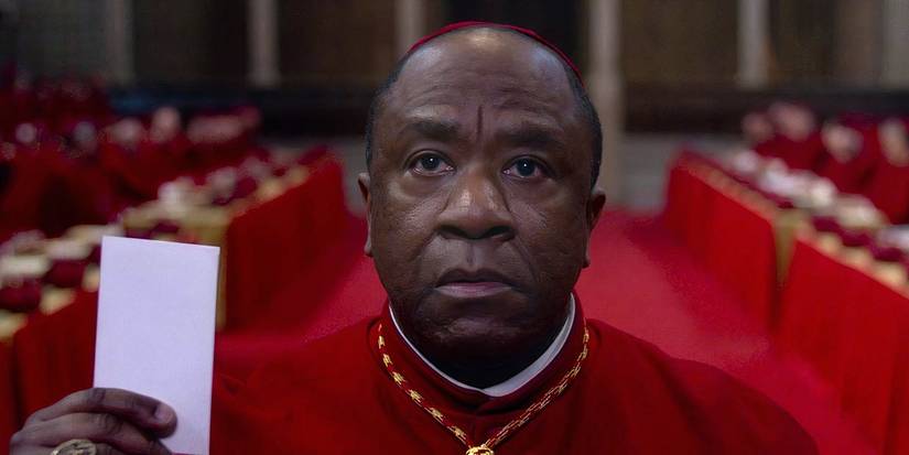 Cardinal Adeyemi holds his ballot in Conclave