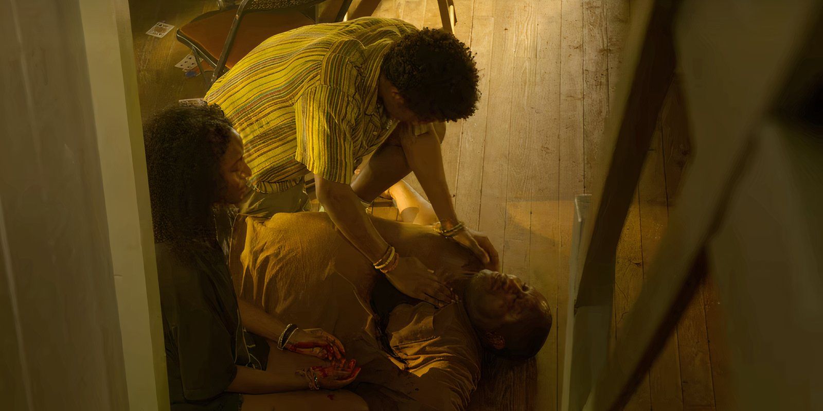 Cleo and Pope, played by actress Carlacia Grant and actor Jonathan Daviss, watch Terrance's body in Netflix's Outer Banks. 