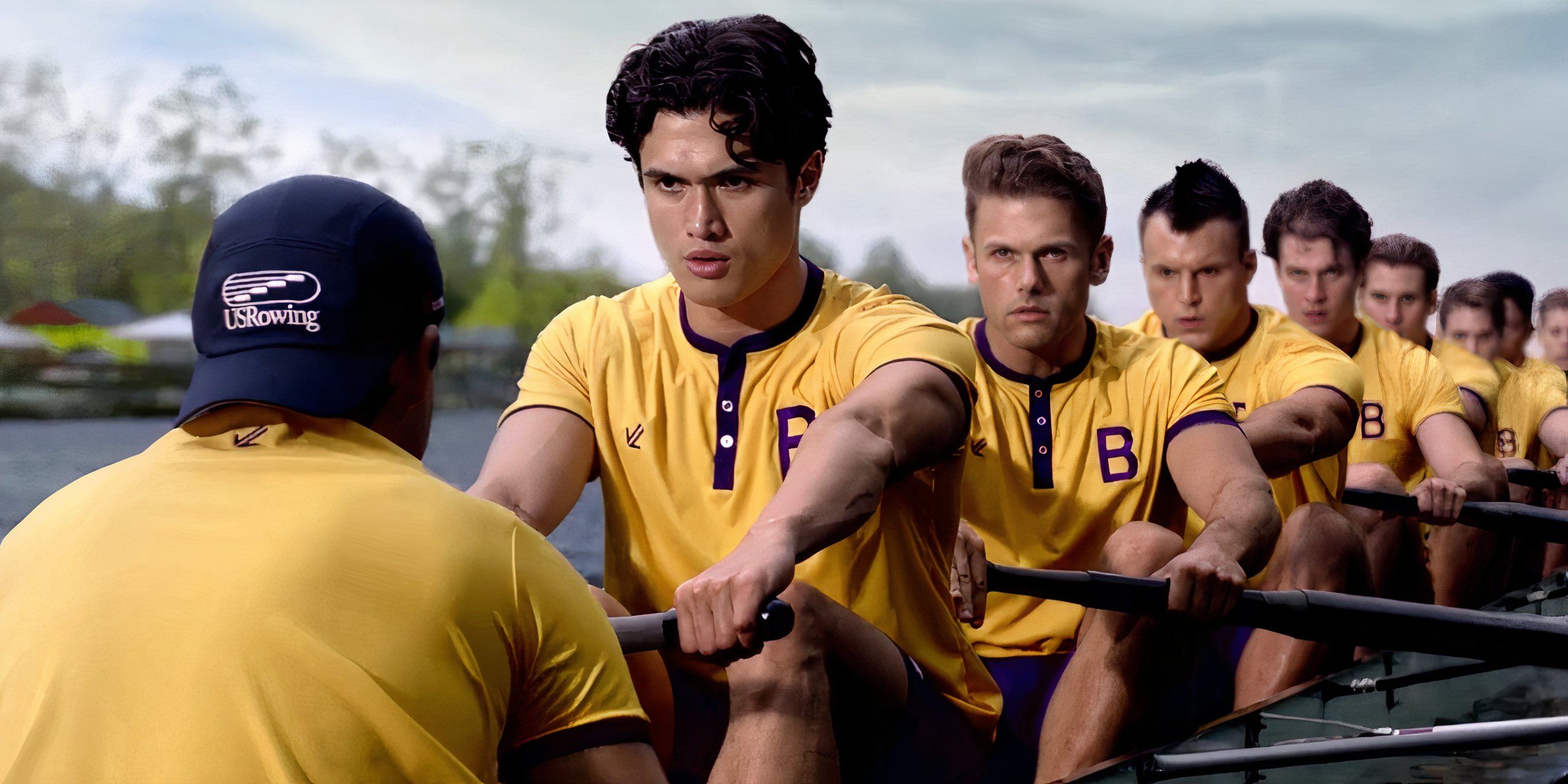 Charles Melton at the front of a boat of rowers in Heart of Champions