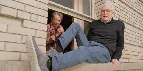 Charles sits on a window ledge cringing while Oliver looks on in horror in Only Murders in the Building season4