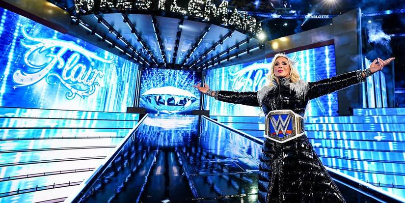 Charlotte Flair with the WWE World Women's Championship SmackDown Women's Title around her waist at WrestleMania 39