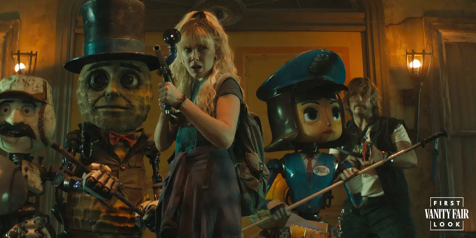 Millie Bobby Brown holds a paintball gun in front of some robots and Chris Pratt in The Electric State