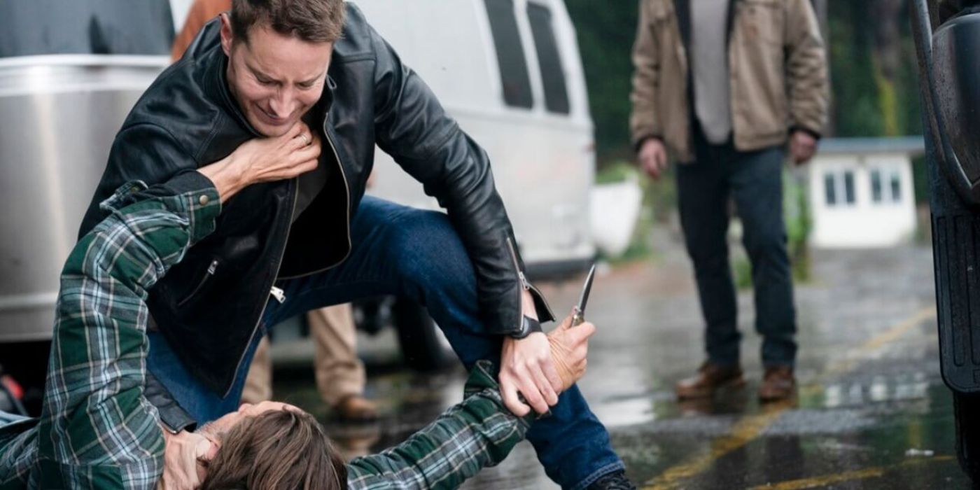 Colter (Justin Hartley) fighting with a man holding a knife in Tracker.