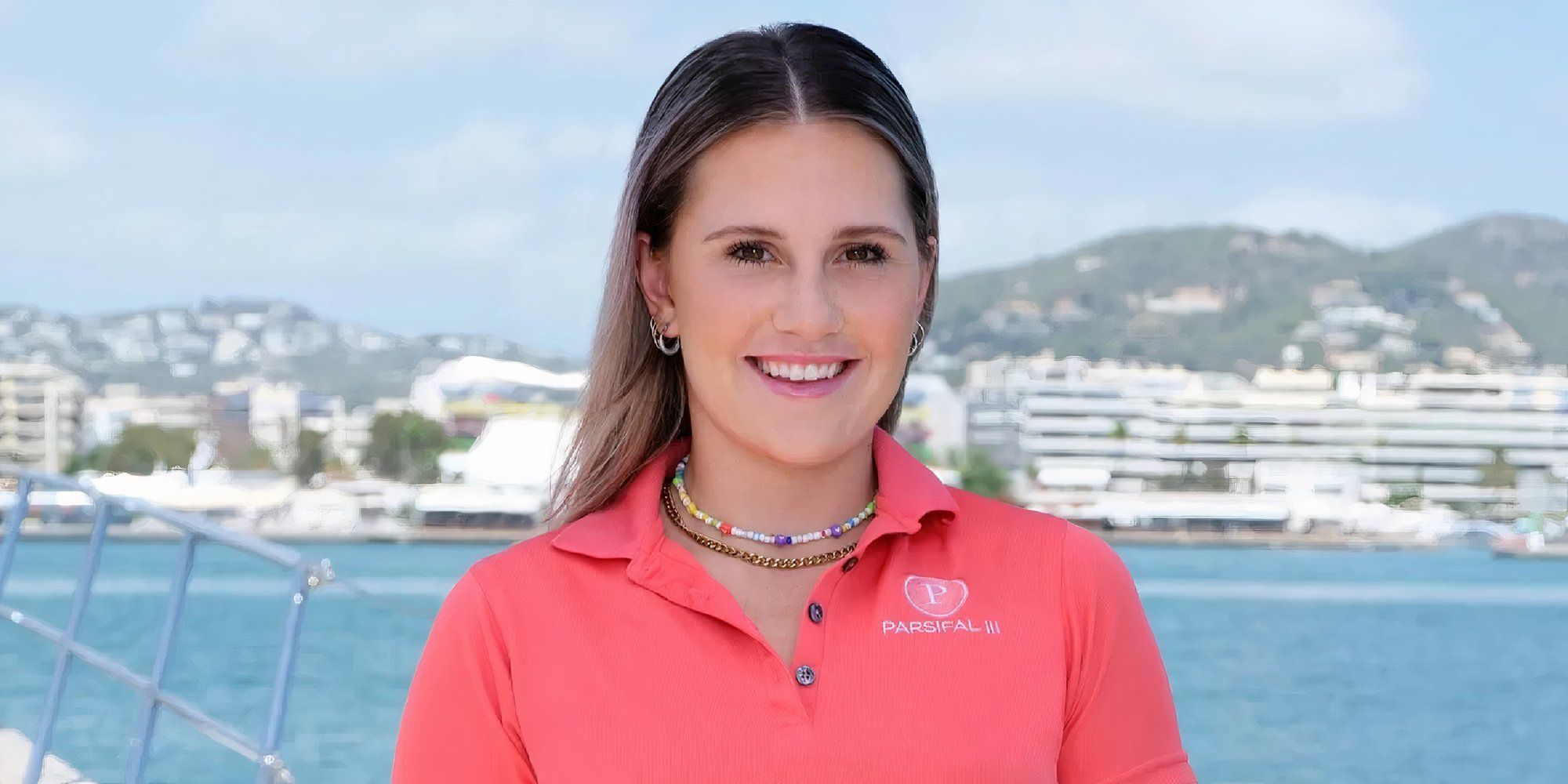 danni warren below deck sailing yacht promo image of her in orange shirt with sea background