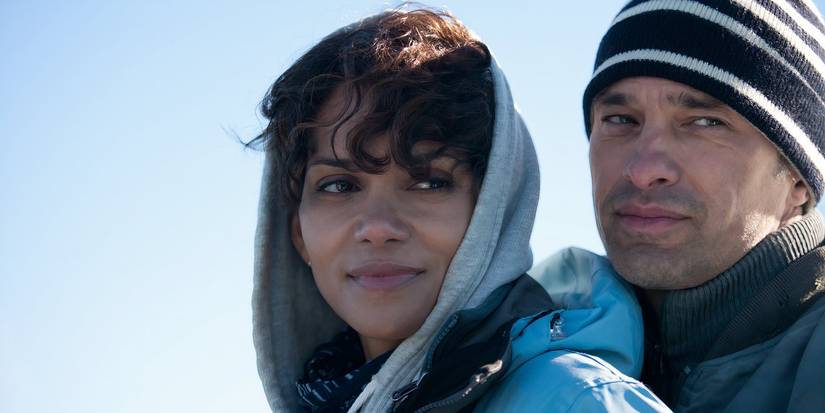 Dark Tide Halle Berry Halle Berry as Kate Mathieson and Olivier Martinez as Jeff Mathieson embrace with the sky in the background