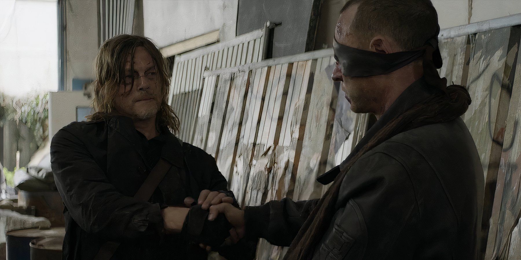 Daryl Dixon (Norman Reedus) shaking hands with Codron (Romain Levi) in The Walking Dead: Daryl Dixon