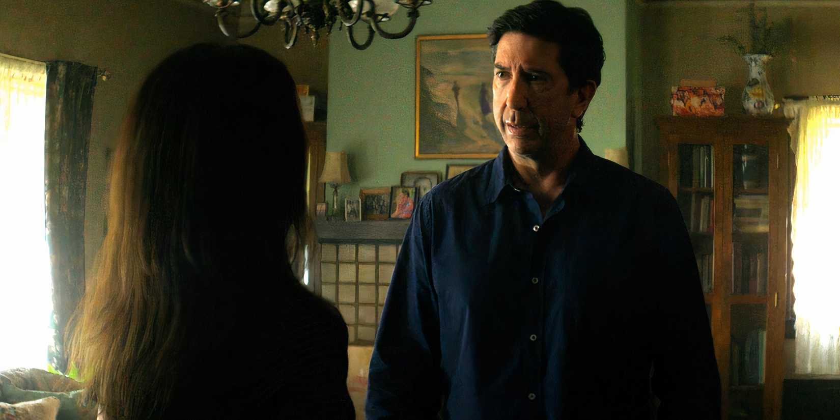 David Schwimmer's Anthony looking seriously at Ana Ortiz' Jen in Goosebumps The Vanishing