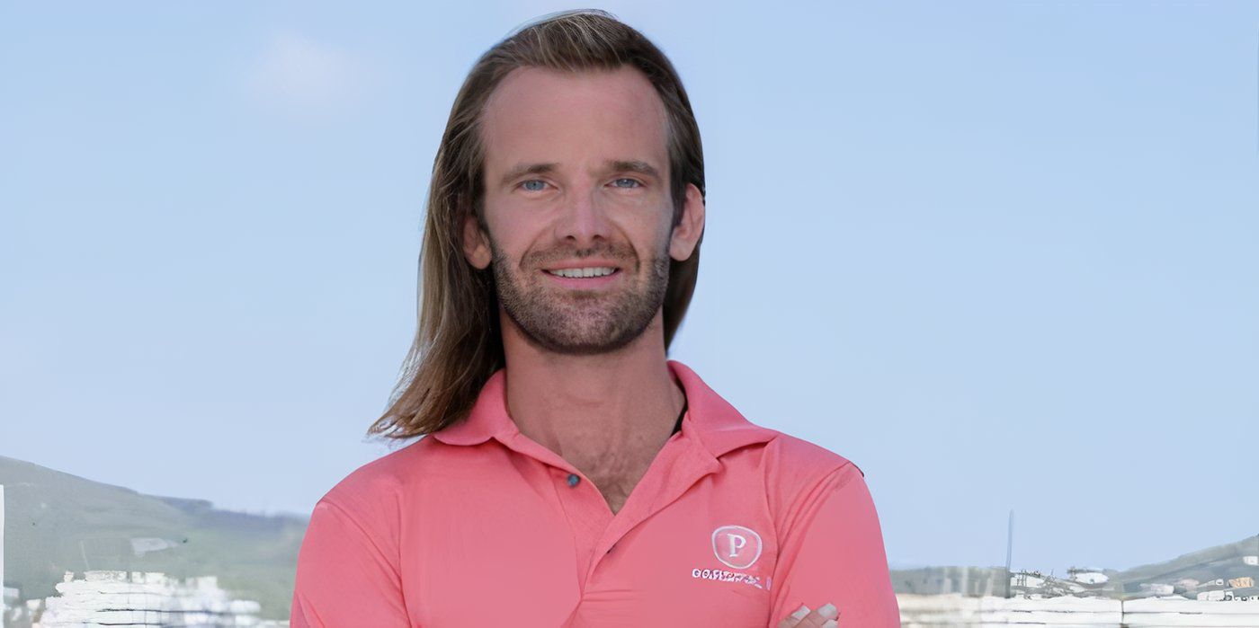 Davide Morosi in Below Deck Sailing Yacht wearing polo on yacht with beach in background