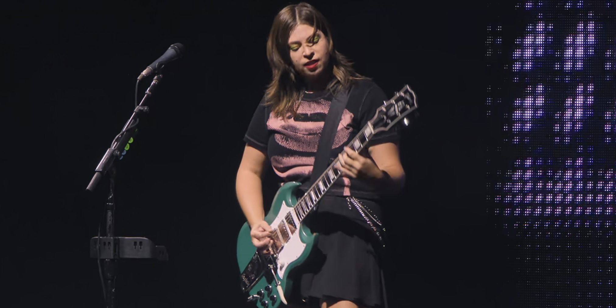 Emily Rosenfield playing guitar in GUTS World Tour