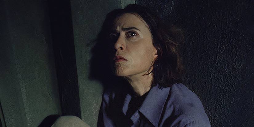 Eunice looks up while in a cell in I'm Still Here
