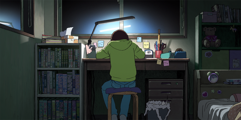 Fujino's back to the audience as she draws manga in Look Back