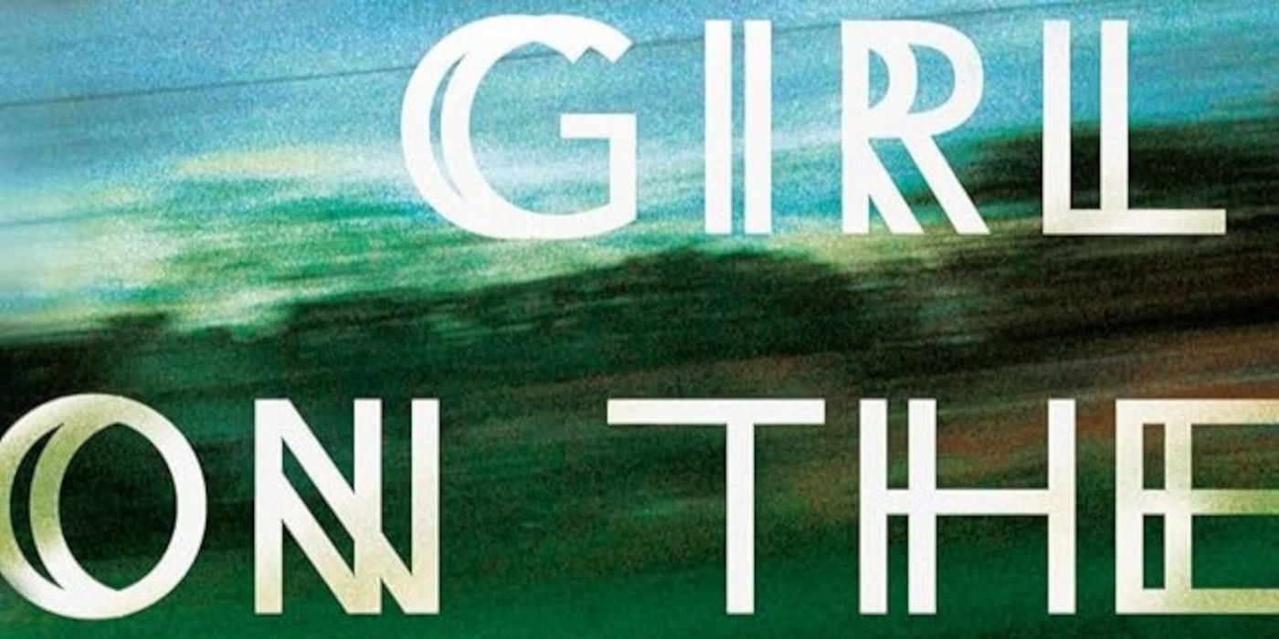 Girl on the Train Cover featuring the title in white and a blurred blue and green background